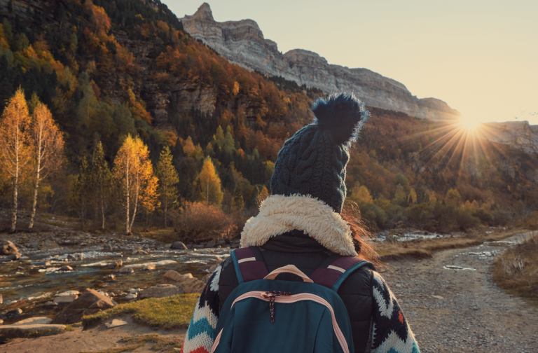 woman walking next to the river